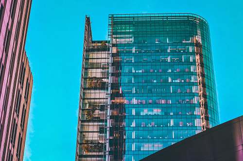 office building red and blue high rise building city